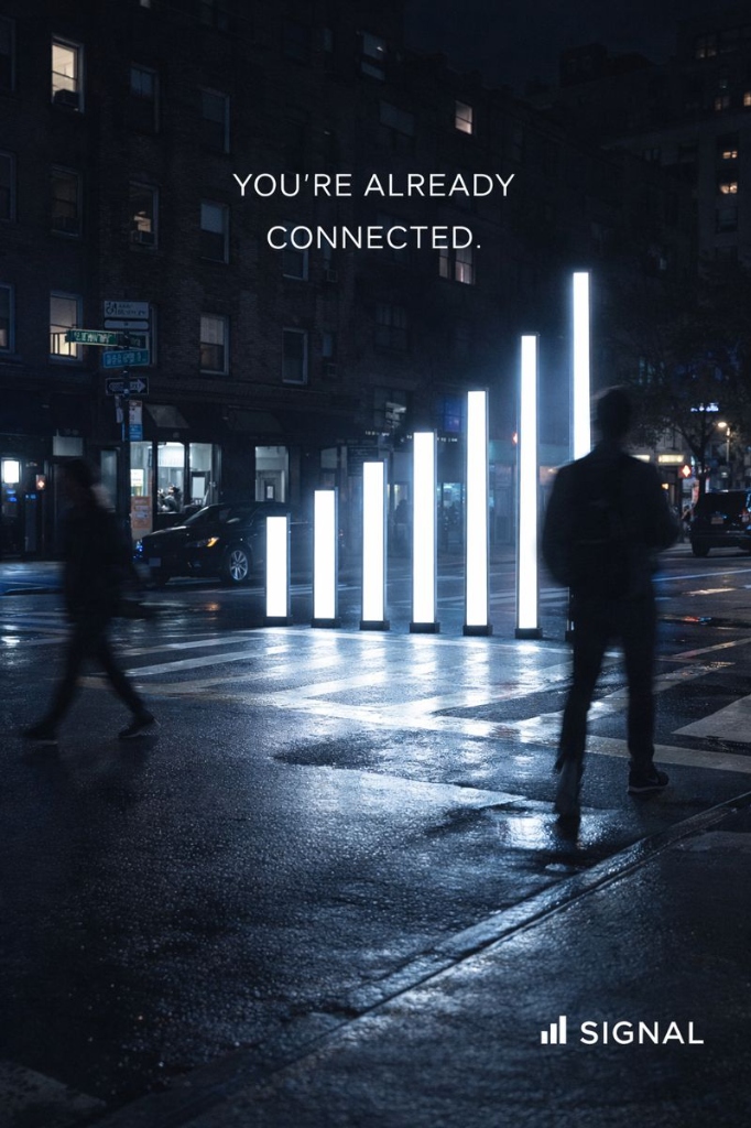 Large glowing signal bar installation in luxury urban night setting by Signal brand